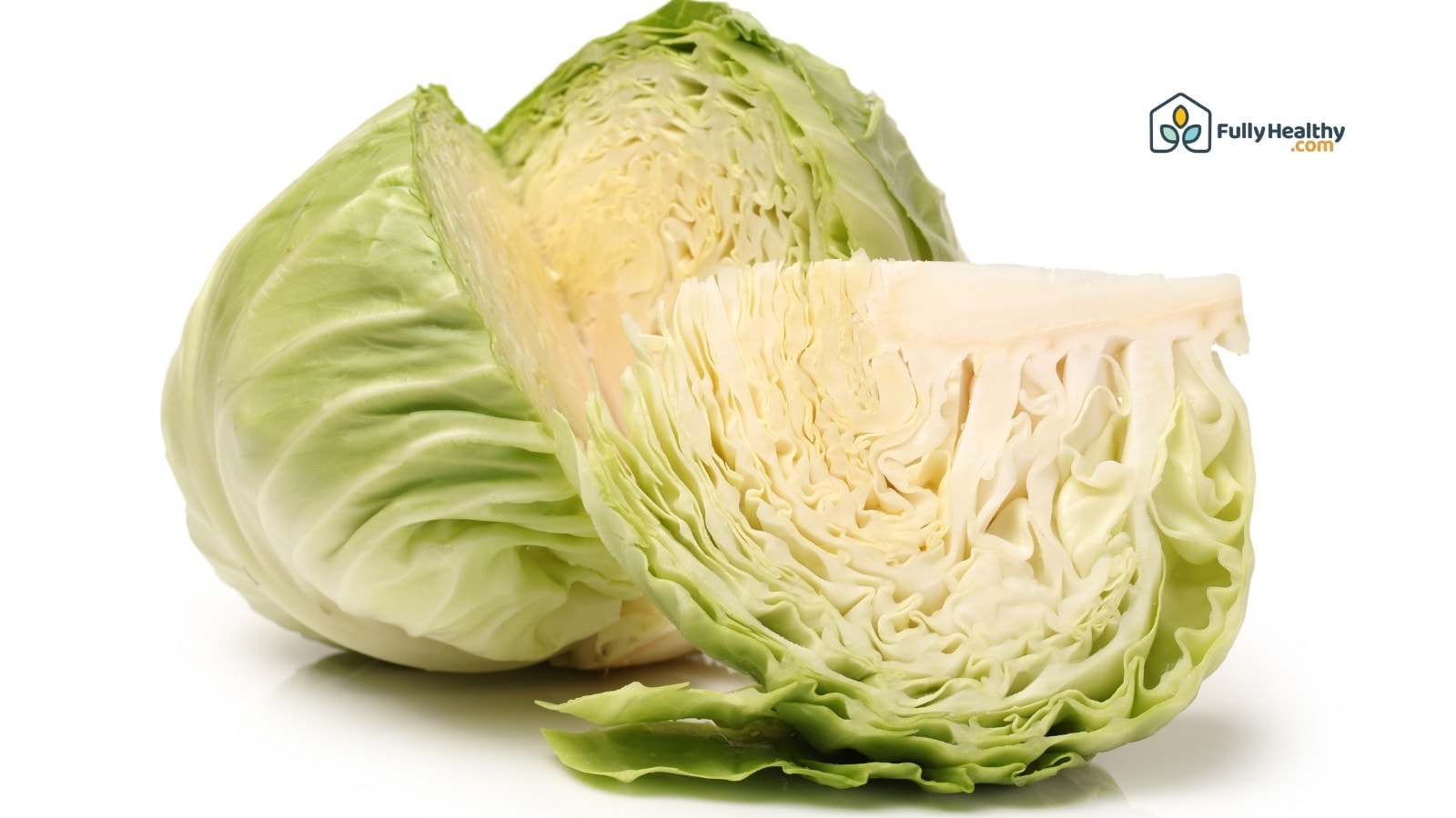 Halved green cabbage showing tightly packed crisp white leafy layers
