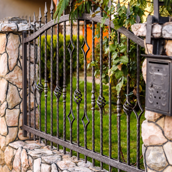 An image showing a high-security wrought iron gate.