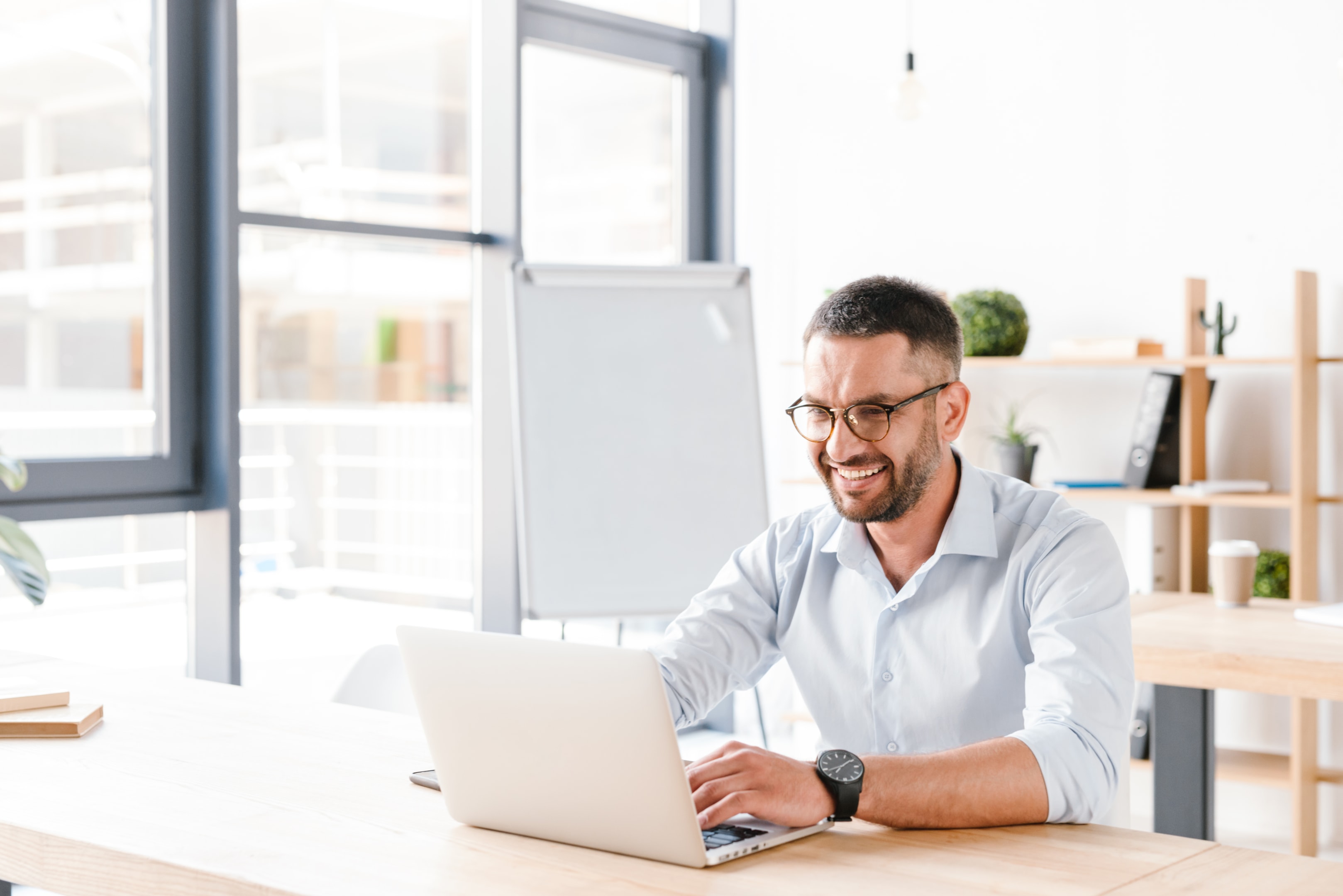 Office worker using a laptop.