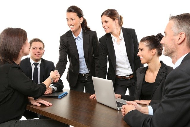 people greeting each other in a business metting