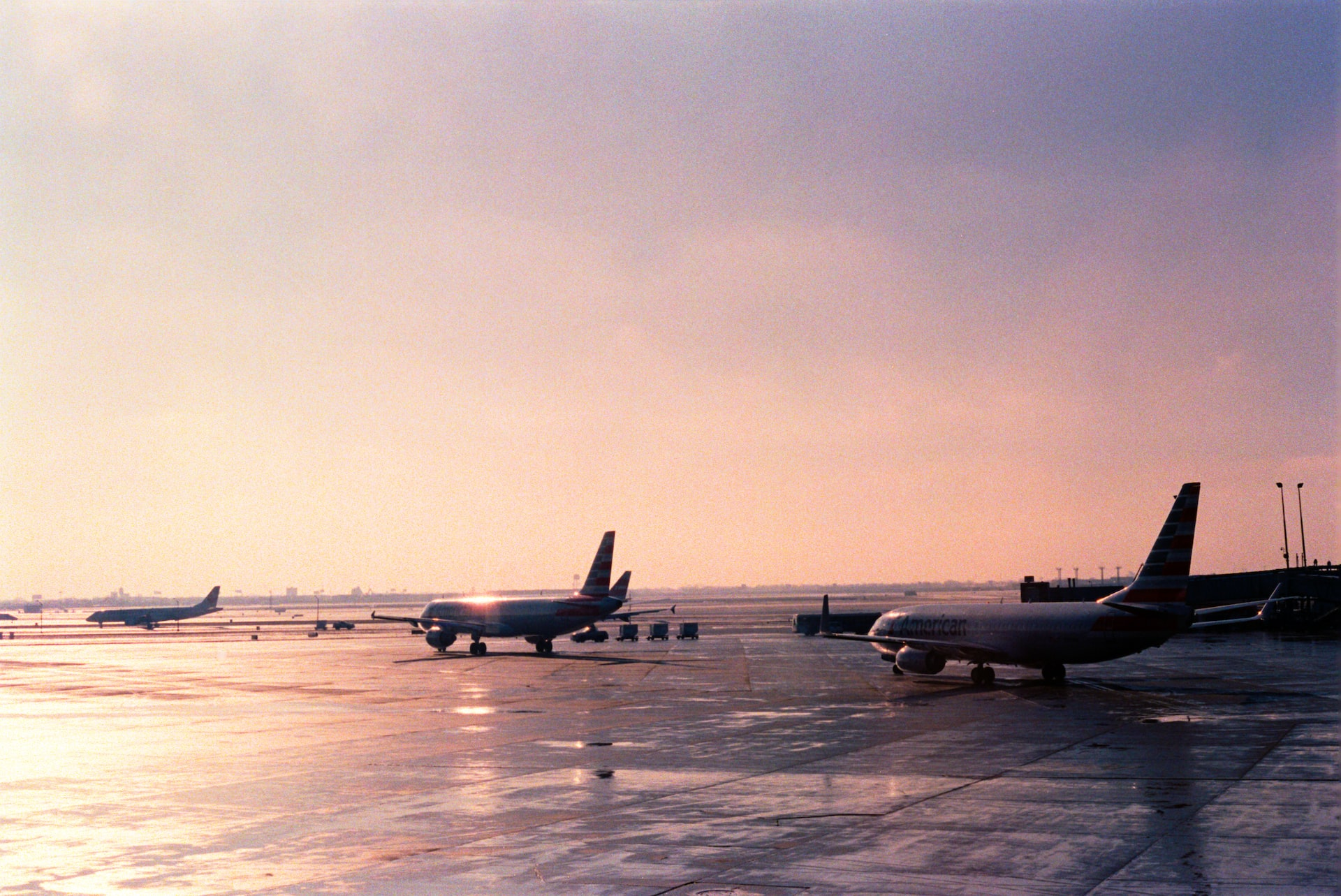 Airliners lining up for takeoff at an airport.