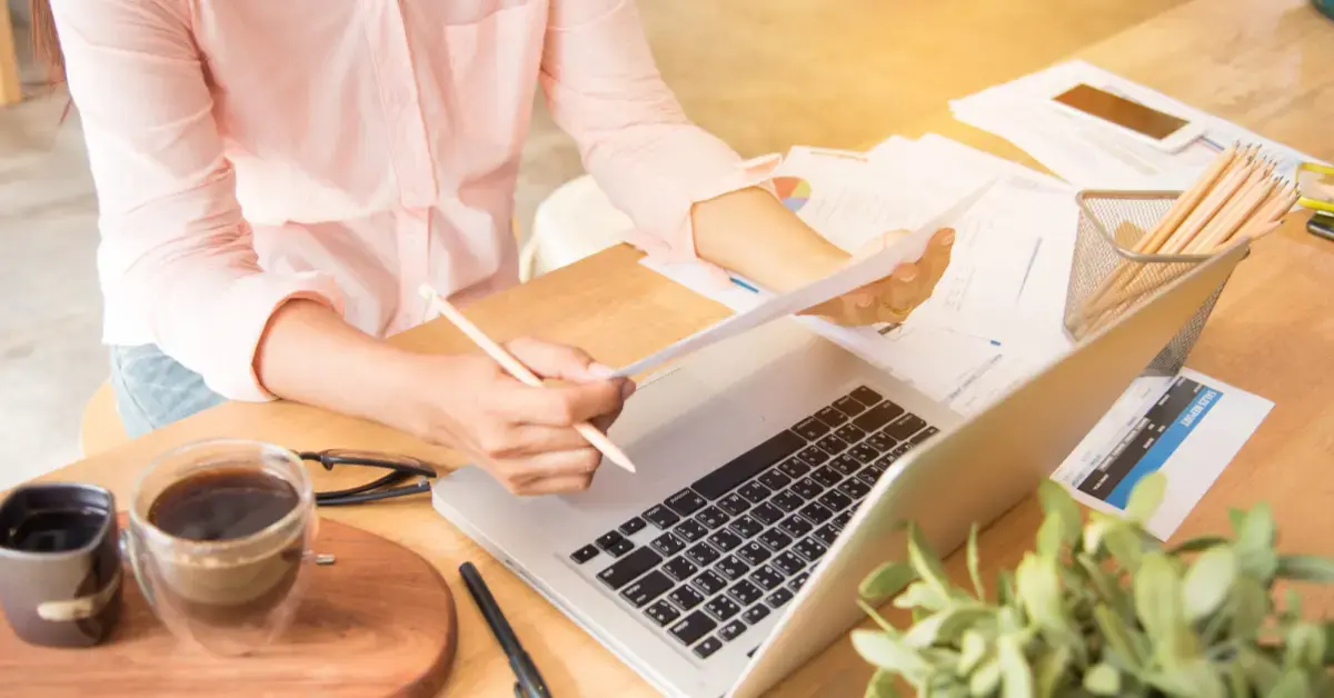 Woman reviewing an IRS transcript and calendar to calculate the collection statute expiration date.