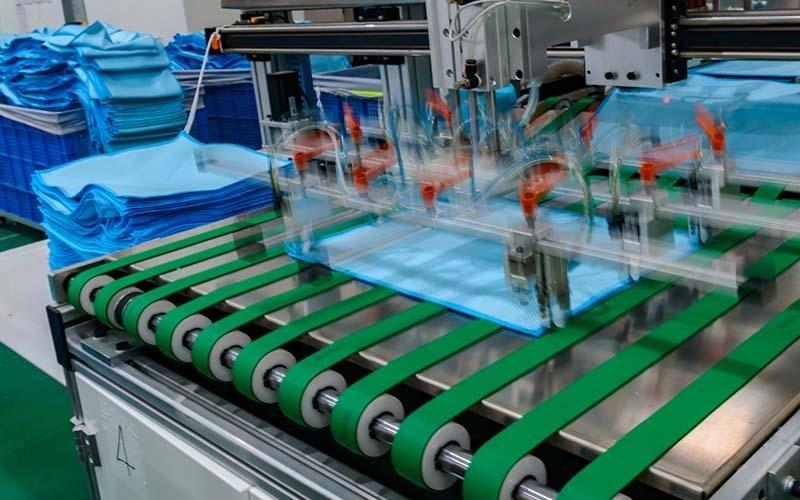 Microfiber edge stitching machine at Manywell Factory