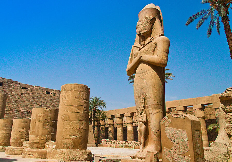 Luxor Temple illuminated at night.