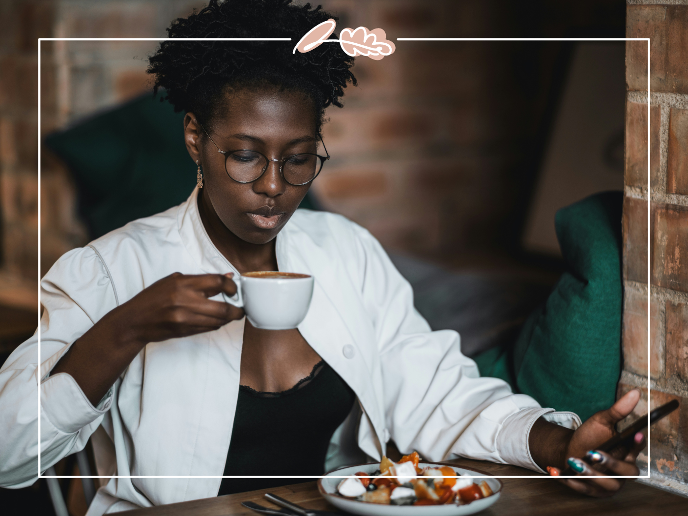 Woman drinking coffee while looking at her phone inside a cozy café. Fabulous Flowers and Gifts