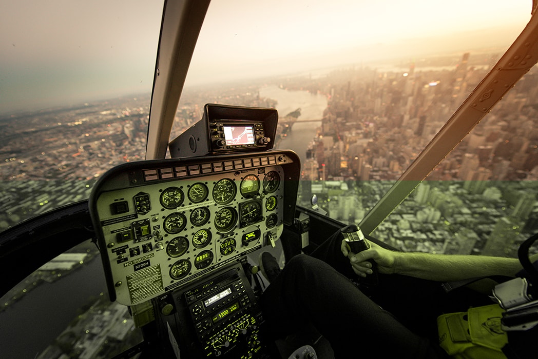 Small aircraft flying over varied terrain during a long distance training flight