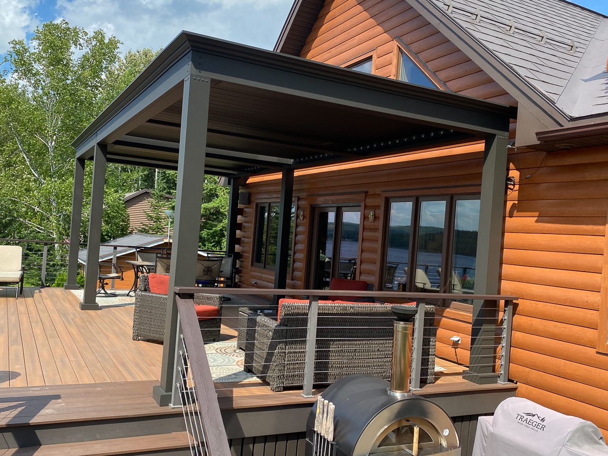 Here is a large custom pergola design on top of a deck.