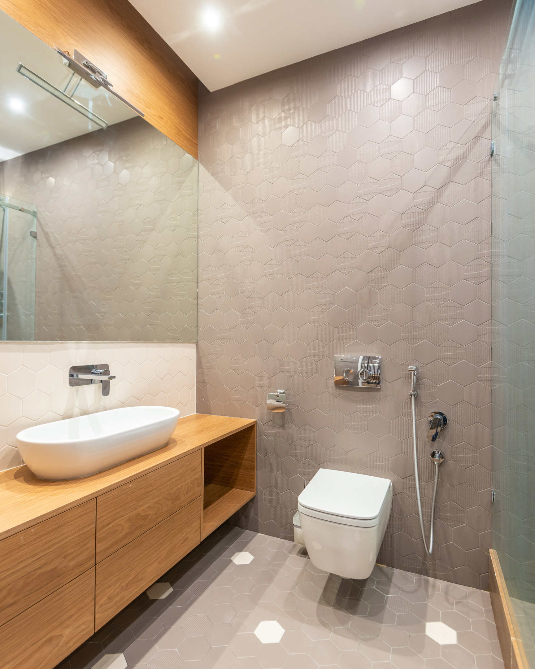 White walls set off by different coloured and textured tiles will revolutionise any bathroom design.