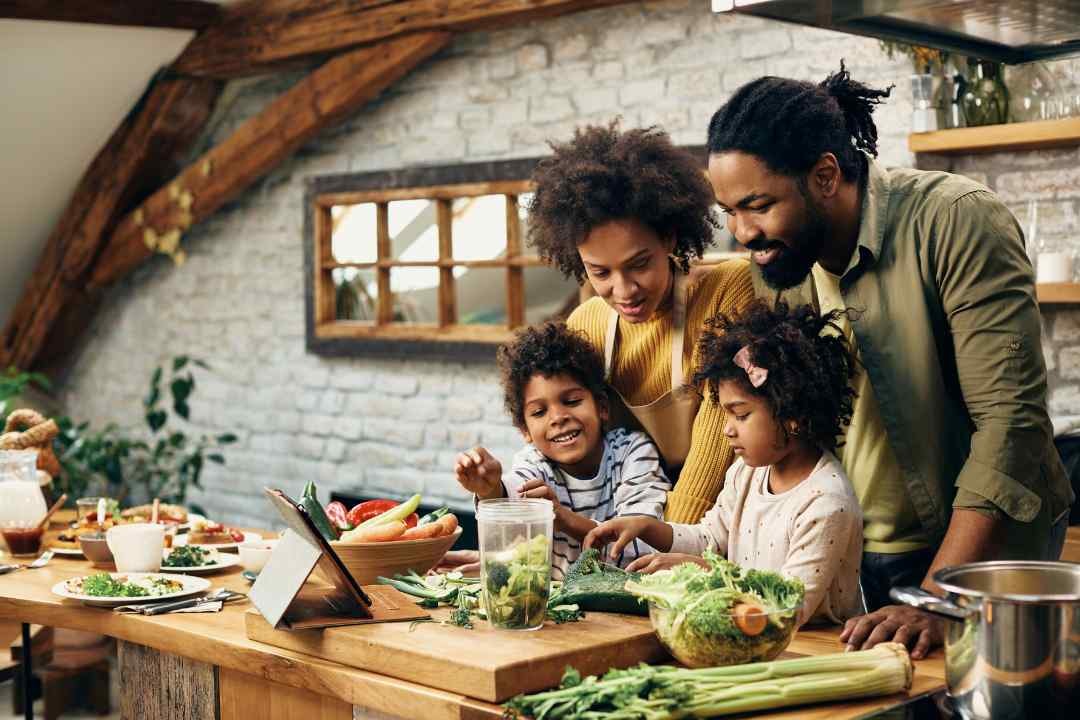 5 Top Reasons to Choose Viridian: A happy family cooking together, promoting a healthy lifestyle with Viridian.