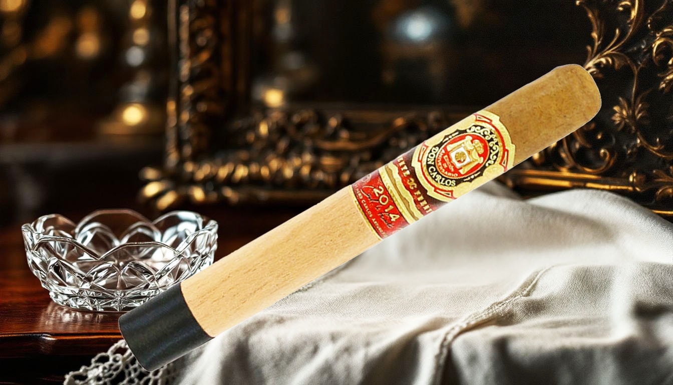 Arturo Fuente Don Carlos Edición de Aniversario Toro cigars, perfect for special occasions, displayed with elegant accessories.