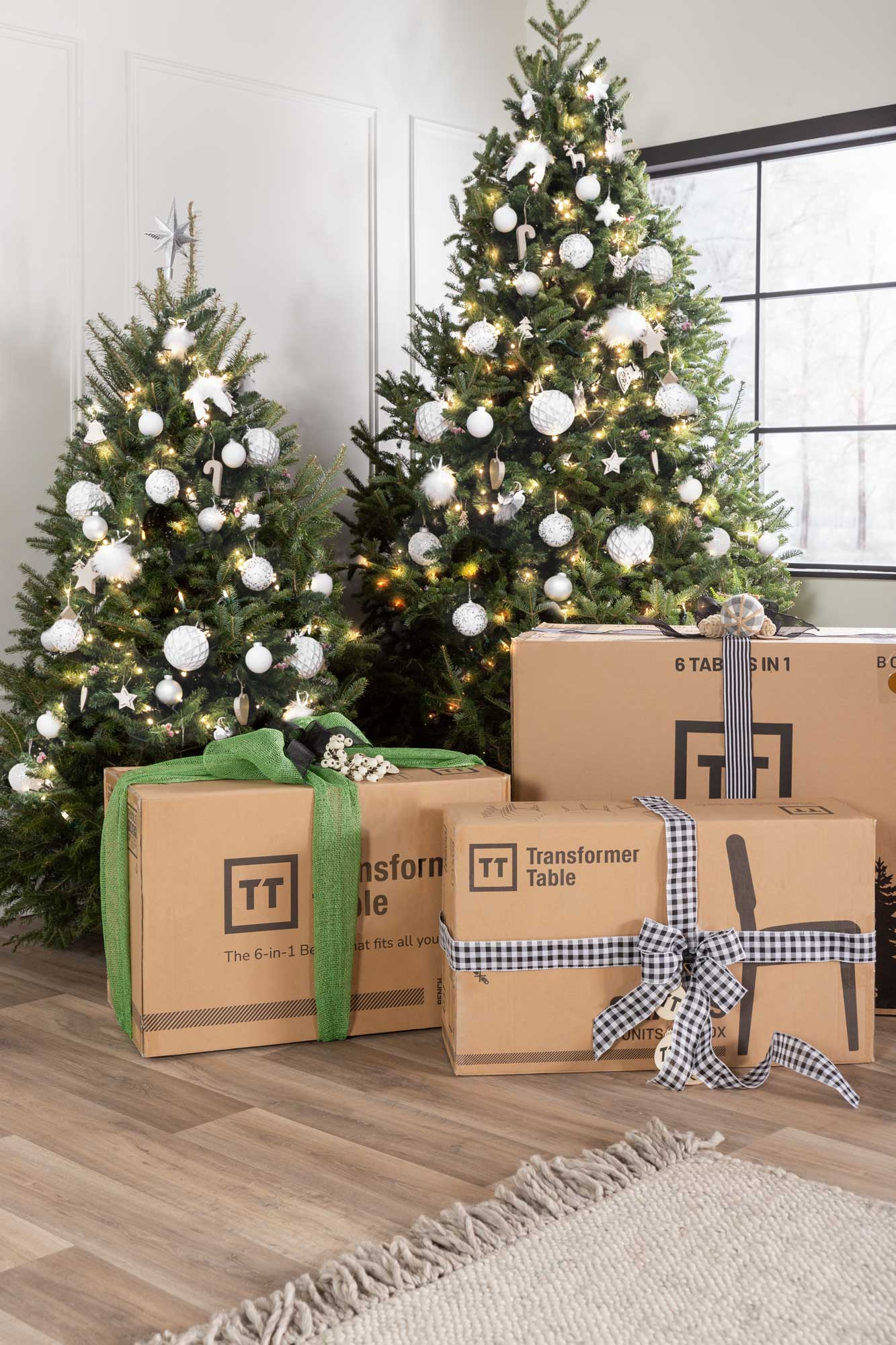 A Christmas tree with boxes in front of it