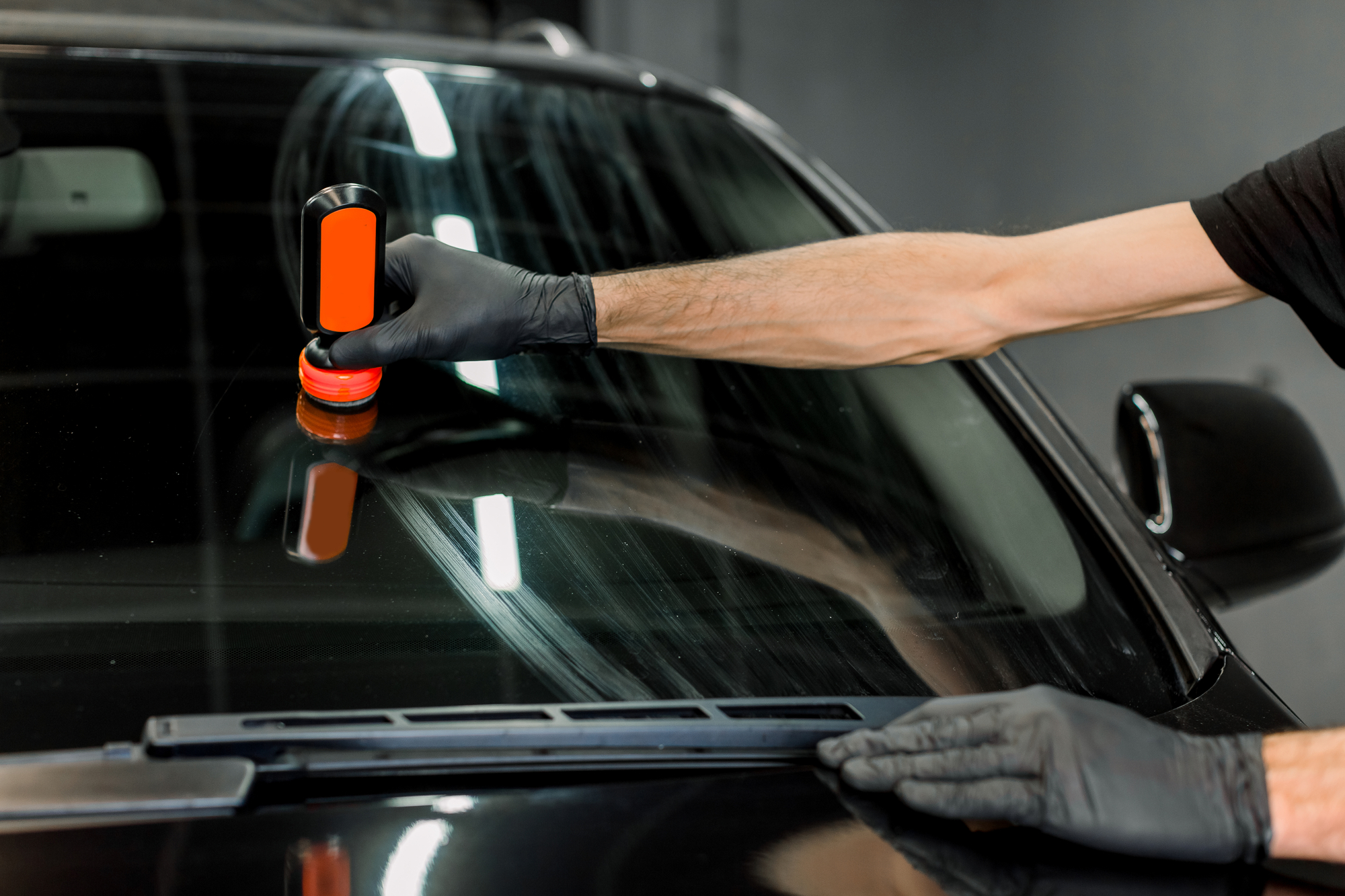 Hand apply protective coating on a windshield