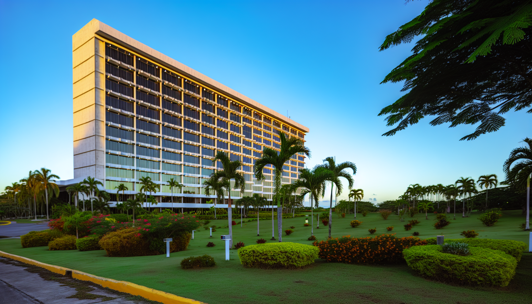 Exterior of a hotel near Juan Santamaría International Airport with lush landscaping