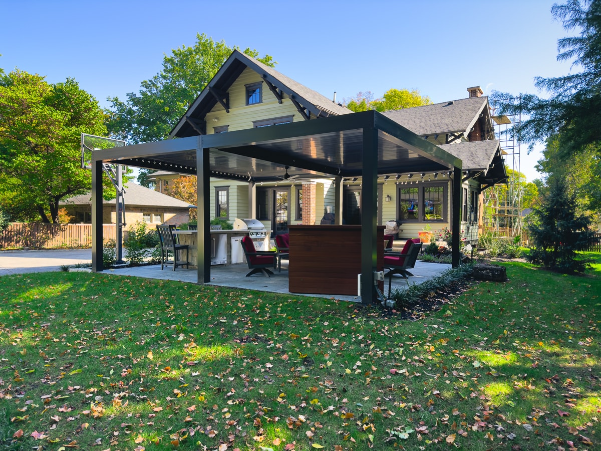 Super Pergola installed over patio with outdoor seating.