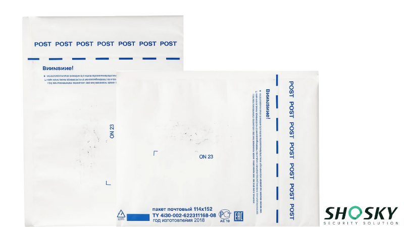 Official exam envelopes featuring blue text and regulatory compliance specifications