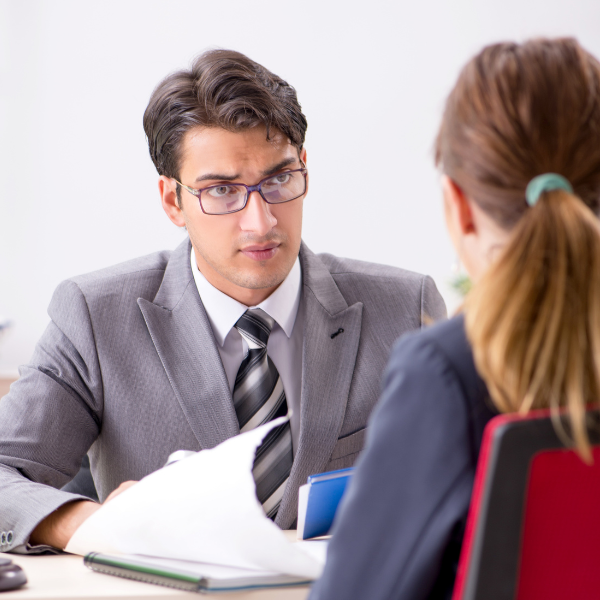 An image showing a person talking with a lawyer in Gadsden after an automobile accident in Alabama. 