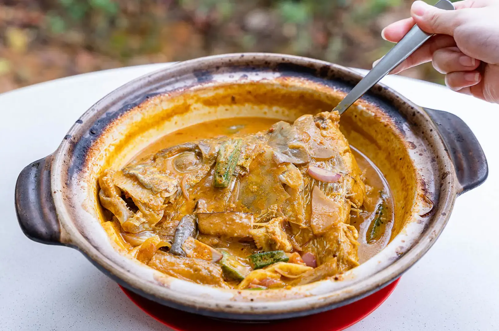 Claypot Curry Fish Head served in a claypot at Ocean Curry Fish Head