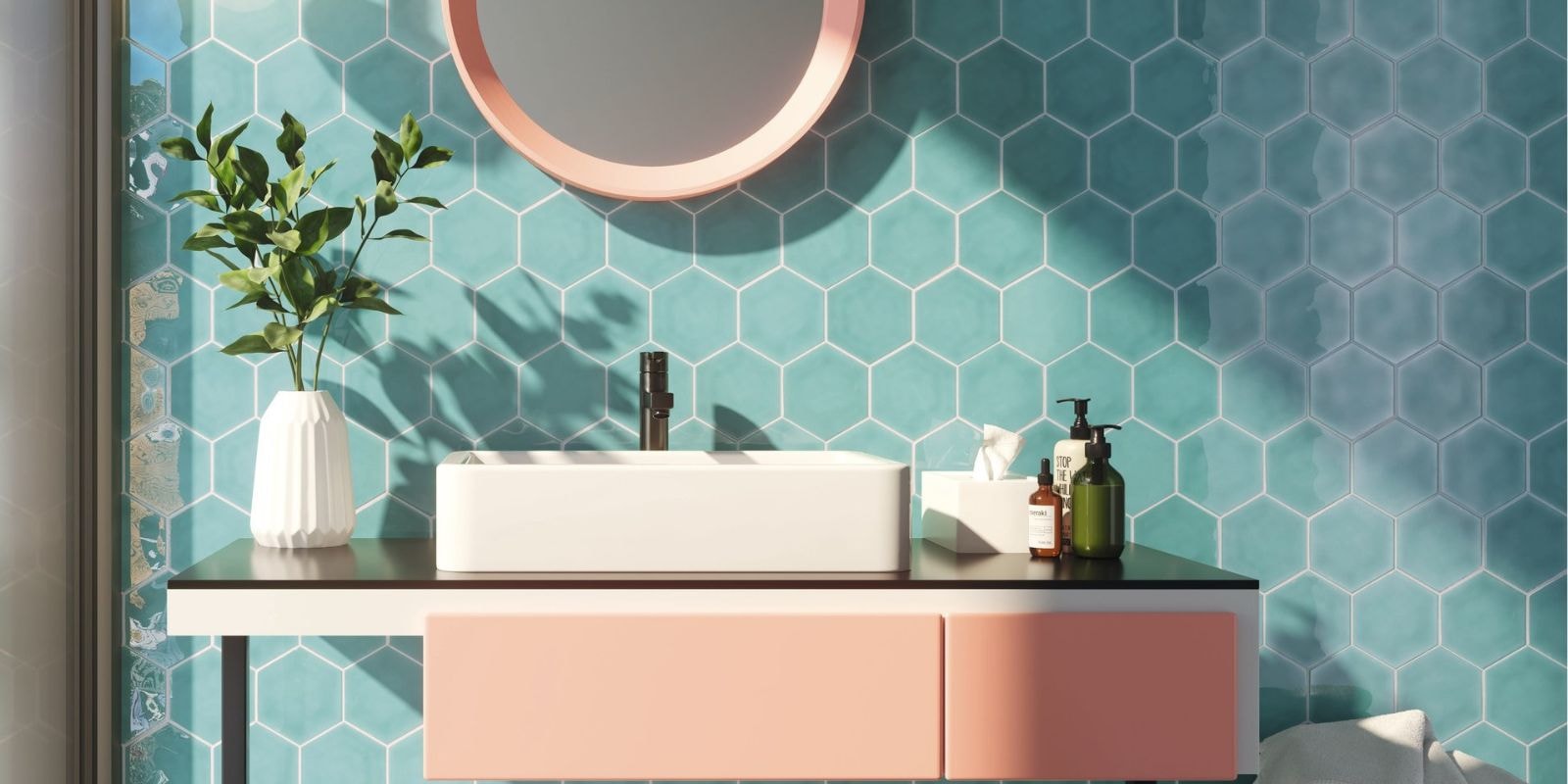 Bright and airy bathroom. teal hexagonal wall tiles with a contrasting salmon pink accessories