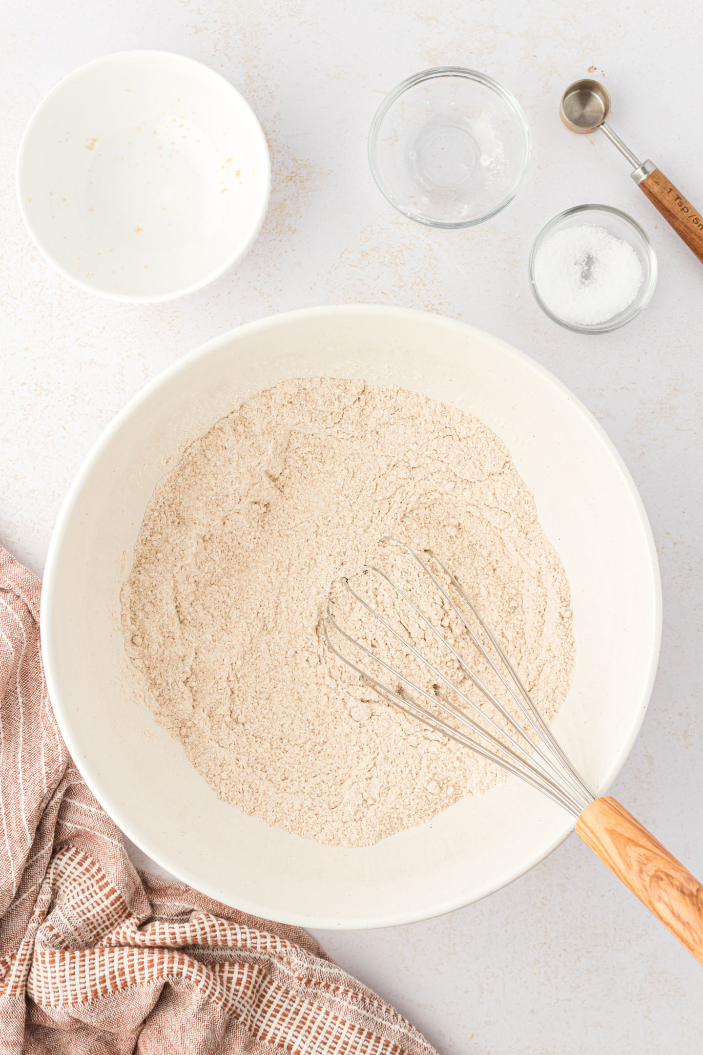 walnut bread flour mixture in a bowl with a whisk