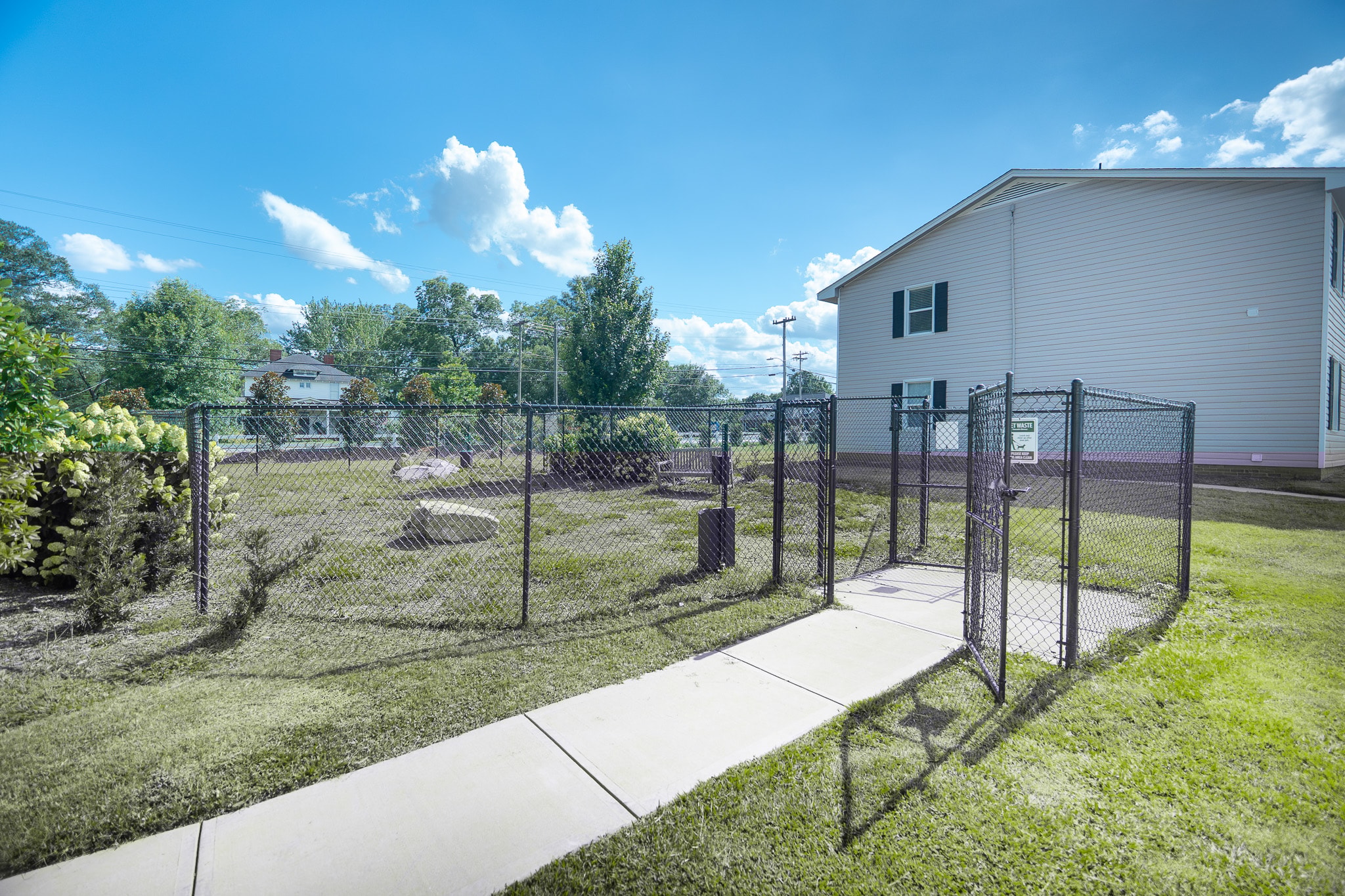 Multifamily real estate community outdoor space and fenced amenities, reflecting strong rental housing demand driven by rising homeownership costs and multifamily investment opportunities.