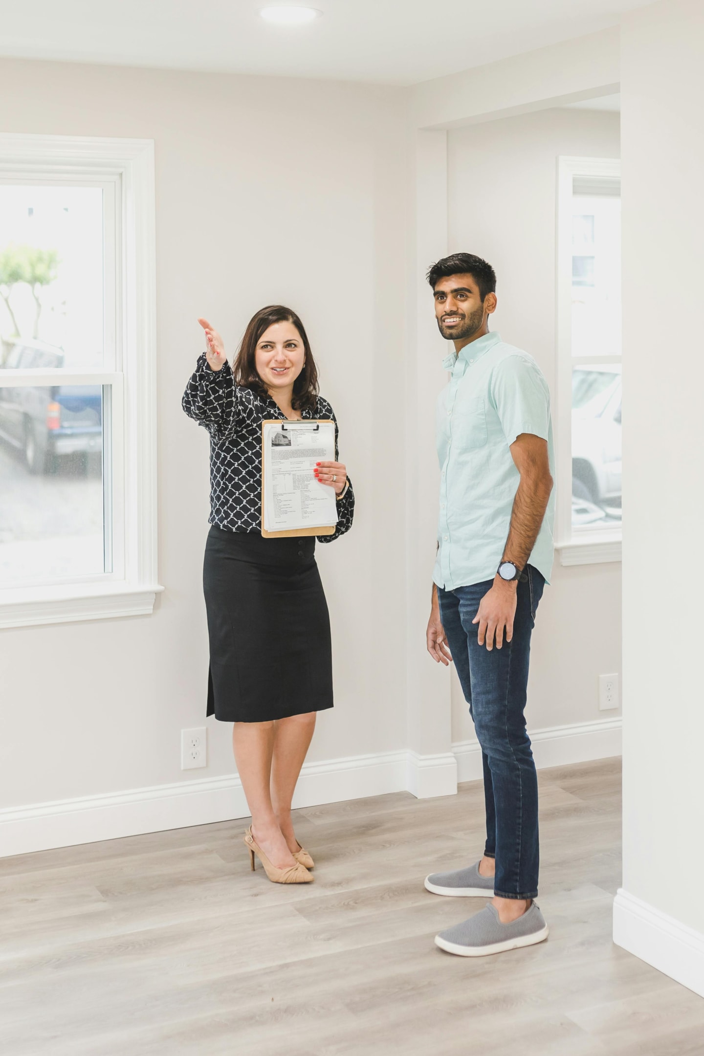 Real estate investor walks through home with motivated seller to produce a valuation.