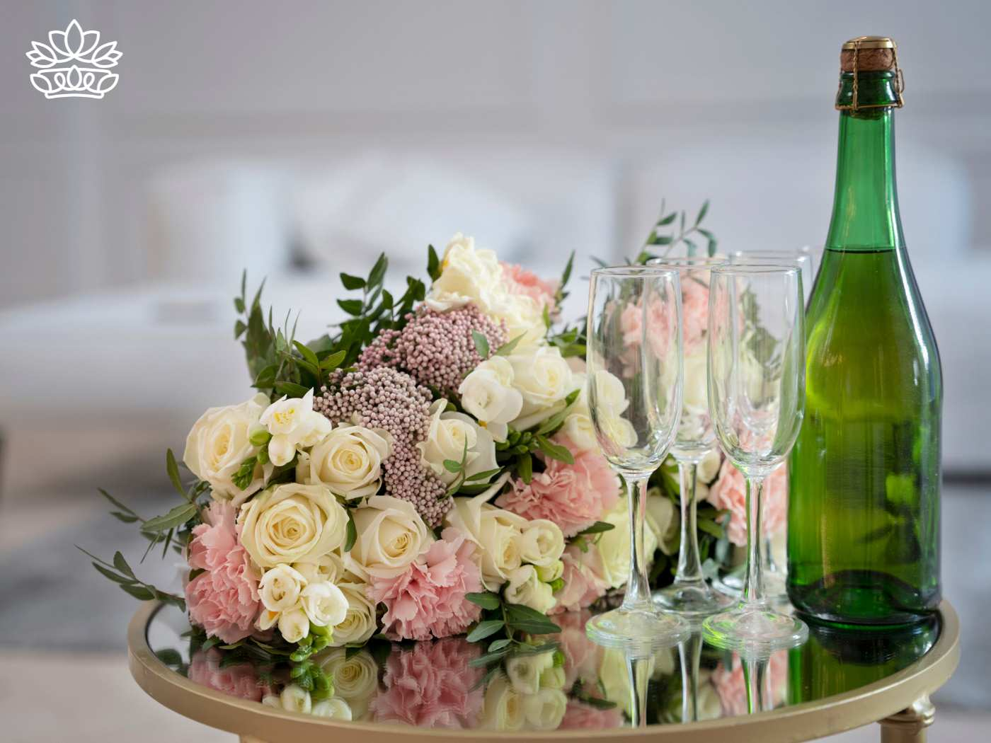 Bouquet of white and pink flowers next to a bottle of champagne and glasses. Flowers with Champagne & Wine. Delivered with Heart. Fabulous Flowers and Gifts.