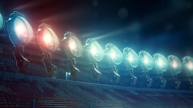 Row of bright stadium lights with BR bulbs
