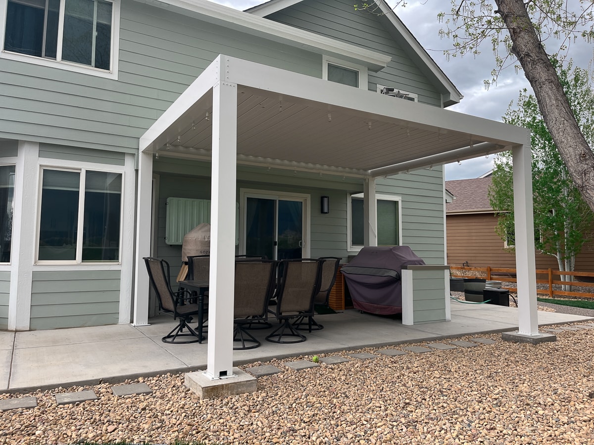 support your pergola with a constructed footer poured into the soil at grade and below the frost line to handle the weight. Rein foced footers may be appropirate.