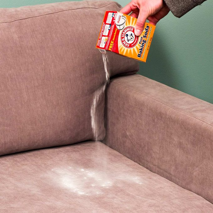 Deodorize and remove the stains of your fabric couch by sprinkling baking soda