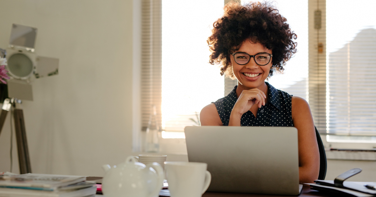 Woman comfortably reviewing her monthly financial statements to track her OnlyFans income and expenses.