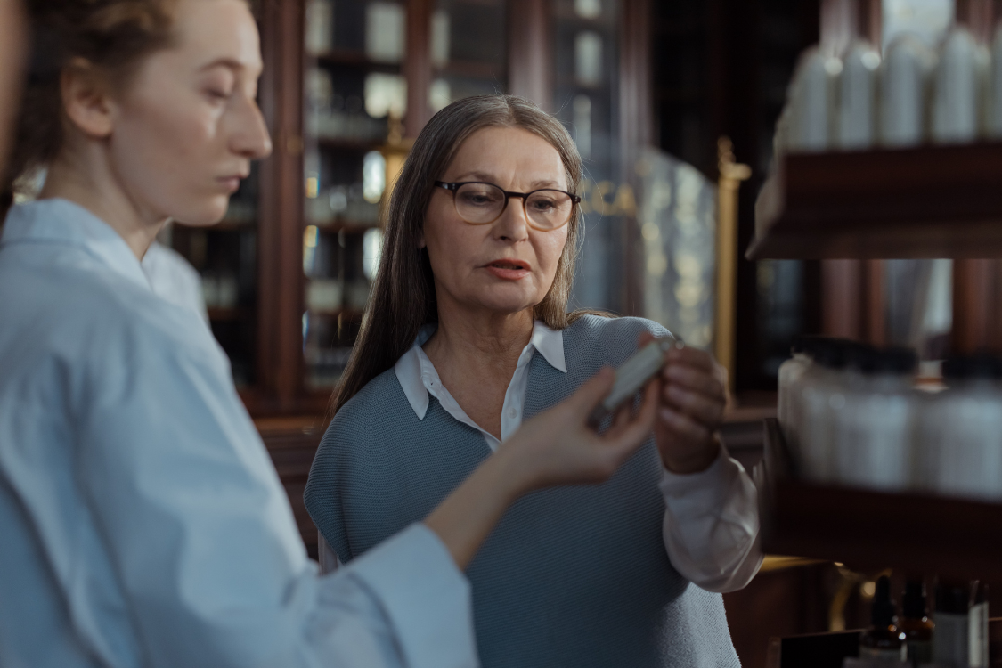 Brand owner and supplement manufacturer discussing ingredient labels and product compliance during a reference review meeting