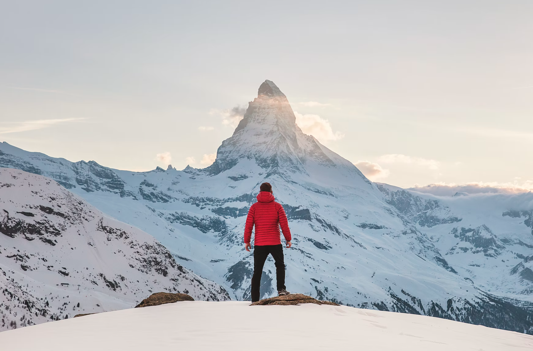 Man staring at snow-covered peak