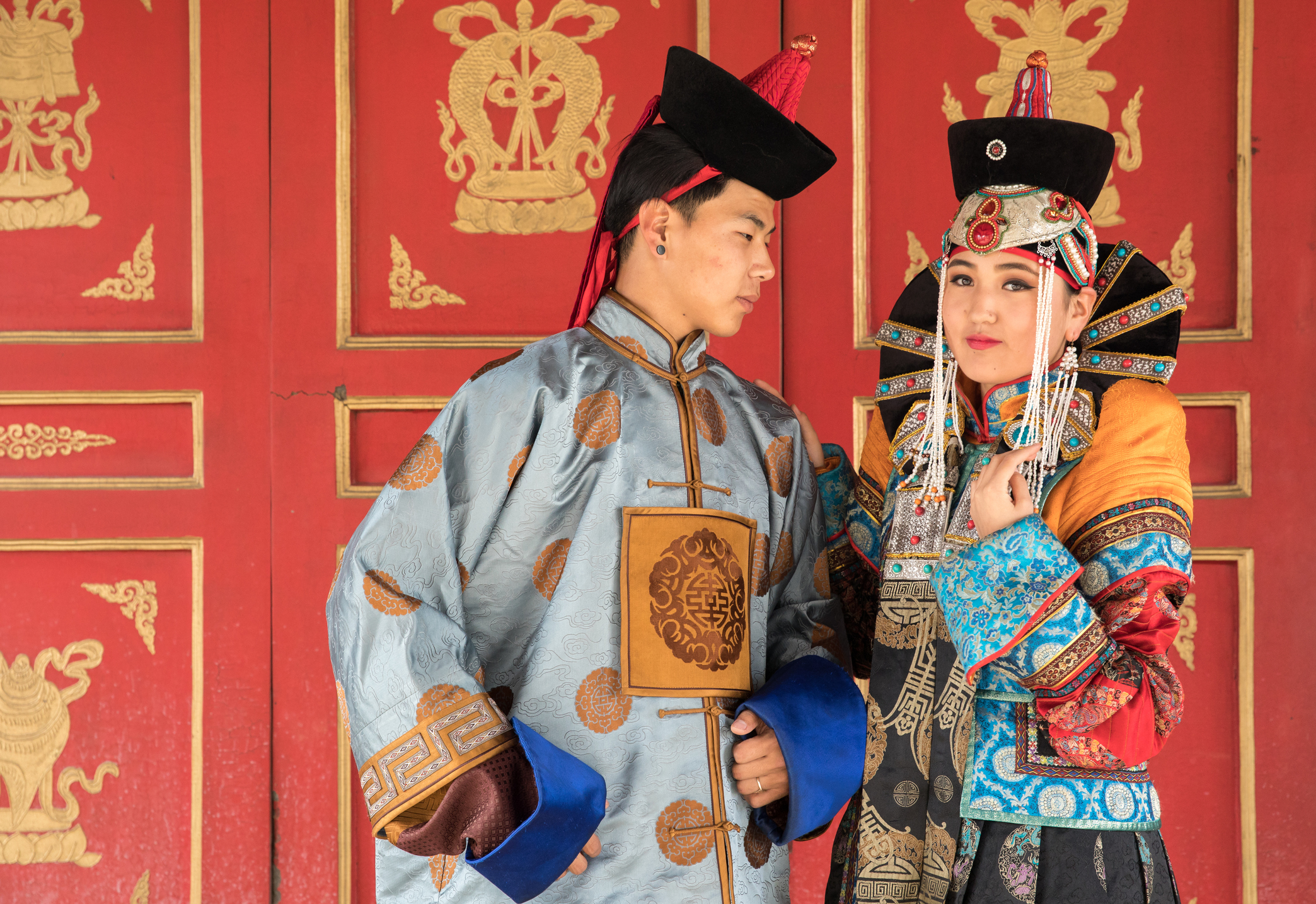 A picture of a Mongolian family in traditional clothing