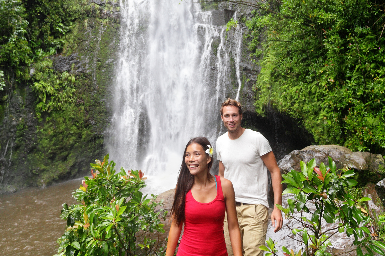 a man and woman hiking near pu uka oku falls