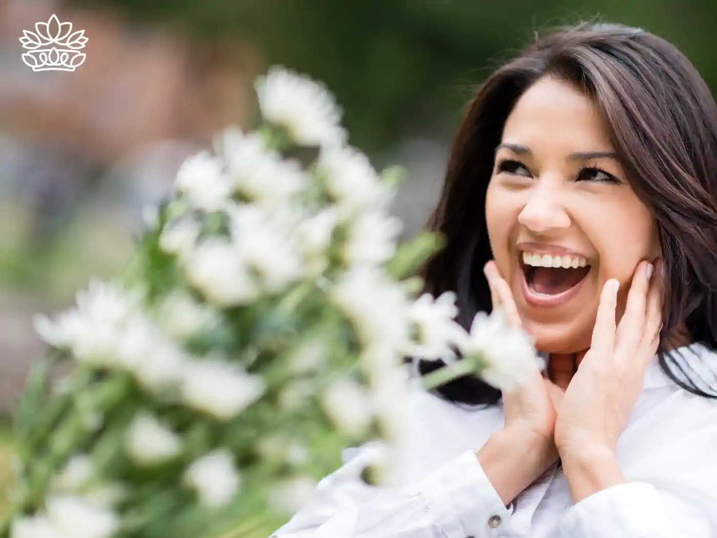 Woman with a delighted expression receiving a bouquet of white flowers in a park. Fabulous Flowers and Gifts, Luxury Flower Arrangements.