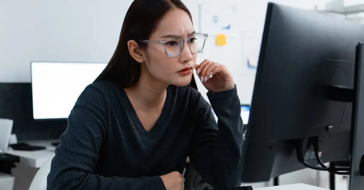 Woman reviewing a CP90 notice with tax records and bank statements.