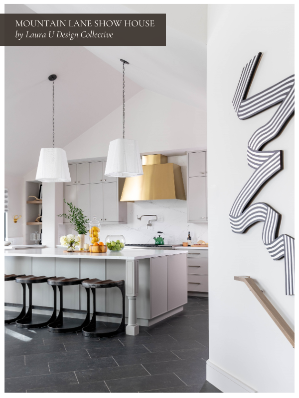 Mountain Lane show house kitchen with a black and white dining room down the stairs; we love the built ins and gold accents