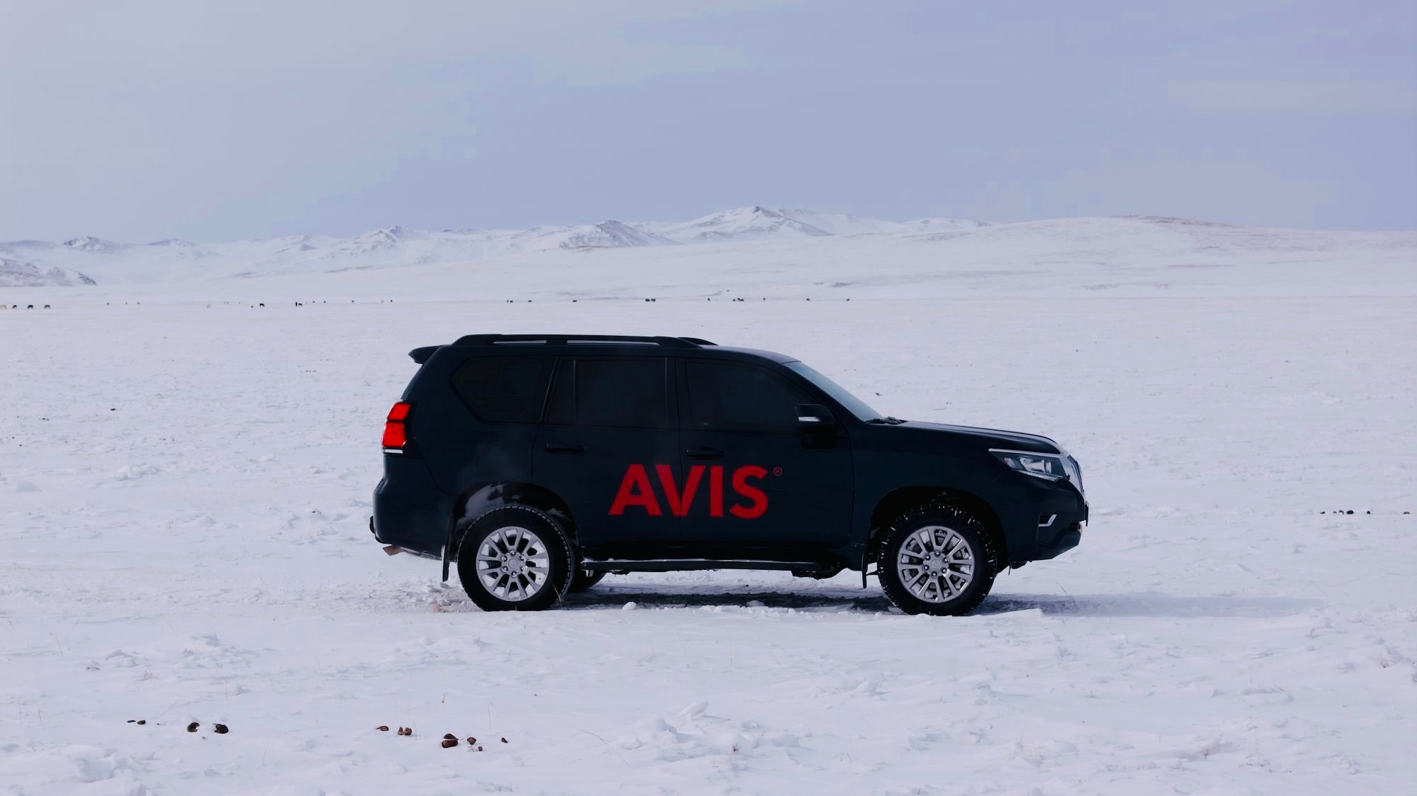 A sturdy Avis SUV ready for a winter trip in Mongolia’s cold weather.