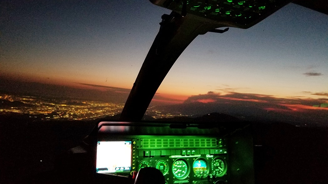 A night flight training session with an aircraft in the sky.