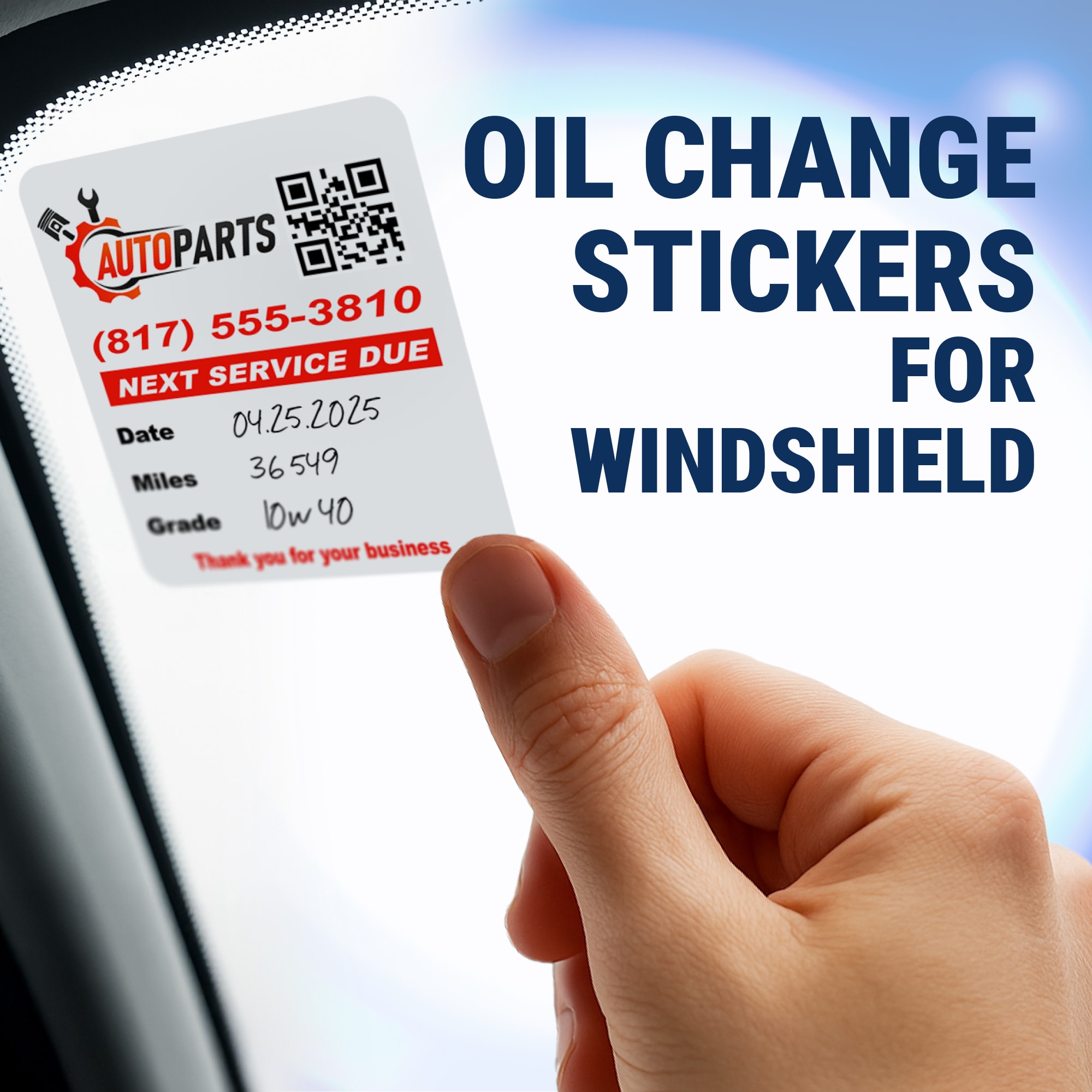 A person applying an oil change sticker to a vehicle.