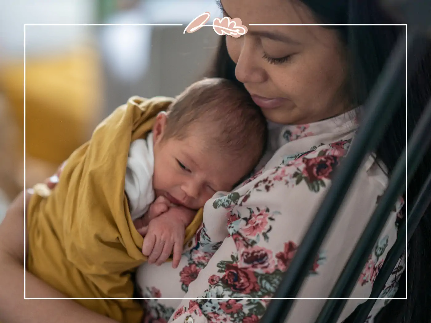 A mother gently cradling her newborn baby, enjoying a quiet, tender moment together. Fabulous Flowers and Gifts.