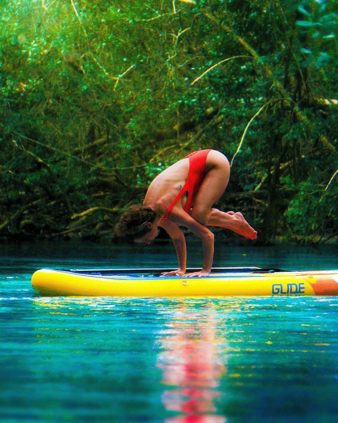 sup yoga on an inflatable paddle board