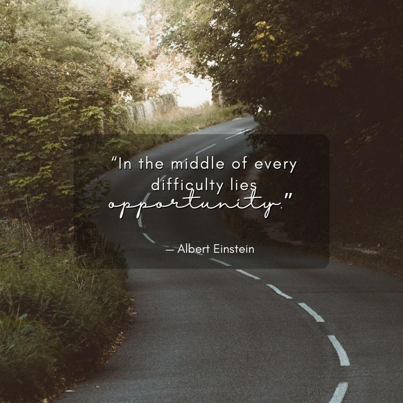 An image of a winding road with an Albert Einstein quote that says, "In the middle of every difficulty lies opportunity."
