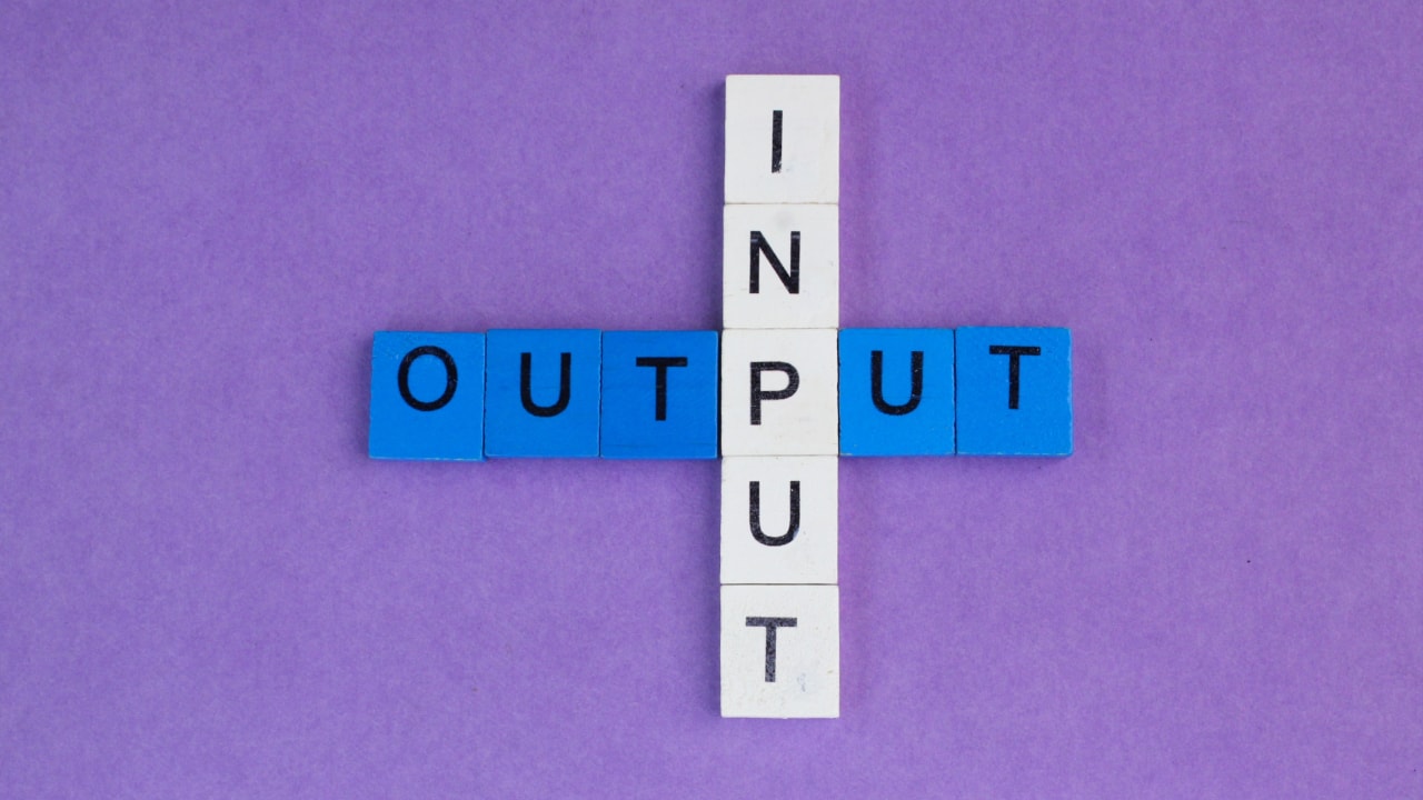scrabble pieces spelling out input output
