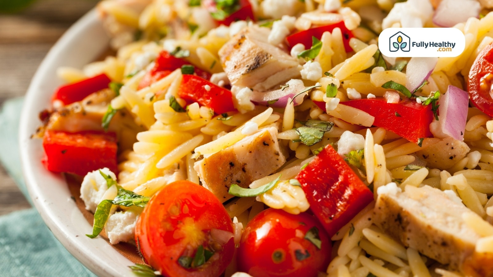 Grilled chicken orzo salad with tomatoes, feta, and fresh herbs