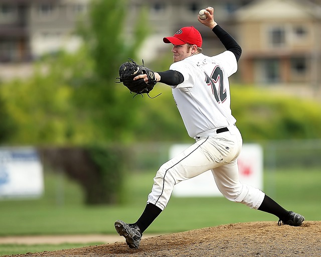 A pitcher in his windup and delivery.