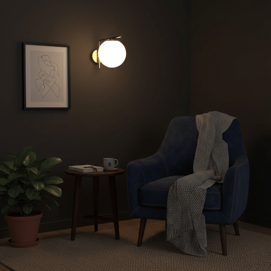 Globe wall sconce casting warm light over a cozy bedroom reading chair and side table.
