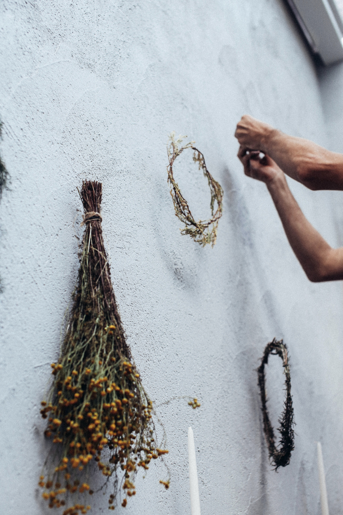 Wreaths of dried flowers embellish the balcony wall