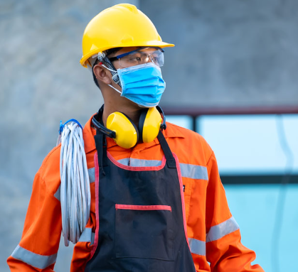 Construction worker wearing a safety mask - dust mask