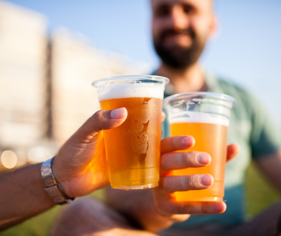               A person looking away from a glass of beer, symbolizing the overcoming of cravings and temptations